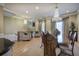 Elegant open-concept living and dining area with hardwood floors and stylish chandeliers at 636 Parkside Village Nw Way, Marietta, GA 30060