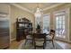Cozy dining room with a stylish chandelier and access to patio at 636 Parkside Village Nw Way, Marietta, GA 30060