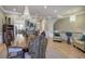 Elegant open-concept living and dining area with hardwood floors and stylish chandeliers at 636 Parkside Village Nw Way, Marietta, GA 30060