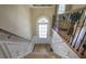 Inviting entryway with wood floors and staircase leading to the upper level at 636 Parkside Village Nw Way, Marietta, GA 30060