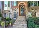 Charming front entrance with stone steps and a brick and stone facade at 636 Parkside Village Nw Way, Marietta, GA 30060