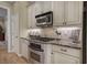 Updated kitchen featuring stainless steel appliances and ample cabinet space at 636 Parkside Village Nw Way, Marietta, GA 30060