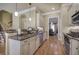 Elegant kitchen featuring granite countertops, stainless steel appliances, and hardwood floors at 636 Parkside Village Nw Way, Marietta, GA 30060