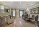 Elegant open-concept living and dining area with hardwood floors and stylish chandeliers at 636 Parkside Village Nw Way, Marietta, GA 30060