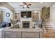 Cozy living room featuring a fireplace, built-in shelving, and elegant furnishings at 636 Parkside Village Nw Way, Marietta, GA 30060