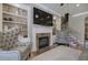 Spacious living room featuring a fireplace, built-in shelves, and comfortable seating at 636 Parkside Village Nw Way, Marietta, GA 30060