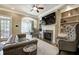 Bright living room featuring a fireplace and built-in bookshelves at 636 Parkside Village Nw Way, Marietta, GA 30060