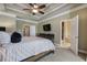 Beautiful primary bedroom featuring a tray ceiling, a ceiling fan and an ensuite bathroom entrance at 636 Parkside Village Nw Way, Marietta, GA 30060