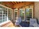 Charming patio with brick and stone accents, comfortable seating, and natural light at 636 Parkside Village Nw Way, Marietta, GA 30060
