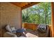Inviting outdoor patio with a cozy seating area and lush green views at 636 Parkside Village Nw Way, Marietta, GA 30060
