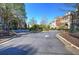 Well maintained community street with meticulously landscaped traffic islands at 636 Parkside Village Nw Way, Marietta, GA 30060