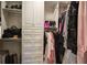 Organized walk-in closet with custom shelving, hanging rods, and ample storage space at 636 Parkside Village Nw Way, Marietta, GA 30060