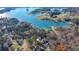 Scenic aerial view of waterfront homes nestled along a lake with numerous docks at 6460 Pine Ridge Cir, Cumming, GA 30041