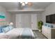 Bright bedroom offers ample natural light, light walls, and clean color design at 6460 Pine Ridge Cir, Cumming, GA 30041