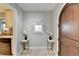 Inviting entryway features a beautiful arched wooden door and elegant decorative accents at 6460 Pine Ridge Cir, Cumming, GA 30041
