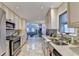 This is a fully equipped kitchen with tile backsplash, stainless appliances and granite countertops at 6460 Pine Ridge Cir, Cumming, GA 30041