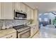 The kitchen offers stainless appliances, granite countertops and ample storage space at 6460 Pine Ridge Cir, Cumming, GA 30041
