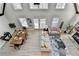 Aerial view of living room with a-frame windows and light wood floors, plus modern decor at 6460 Pine Ridge Cir, Cumming, GA 30041