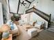 Inviting living room showcases vaulted ceilings, stone fireplace, and open staircase at 6460 Pine Ridge Cir, Cumming, GA 30041