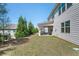 Backyard features a well manicured lawn and covered patio area at 224 Gallant Fox Way, Acworth, GA 30102