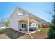 Exterior image of backyard with a covered patio and lush green lawn at 224 Gallant Fox Way, Acworth, GA 30102