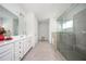 Bathroom with double vanity sinks, tile floor, glass shower, and a separate tub at 224 Gallant Fox Way, Acworth, GA 30102