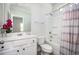 Bright bathroom featuring white cabinets, a large mirror, shower/tub combo, and modern fixtures at 224 Gallant Fox Way, Acworth, GA 30102