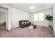 Cozy living room with a gray sofa, coffee table, and a window at 224 Gallant Fox Way, Acworth, GA 30102