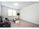 Spacious living room featuring a gray sofa, coffee table, and a window at 224 Gallant Fox Way, Acworth, GA 30102