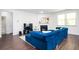 Bright living room featuring a fireplace and a comfortable blue sofa at 224 Gallant Fox Way, Acworth, GA 30102