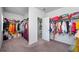 Spacious walk-in closet with ample storage and racks for hanging clothes at 224 Gallant Fox Way, Acworth, GA 30102