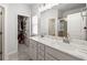 Bright bathroom with double vanity, granite countertops, and a glass-enclosed shower at 4565 Grenadine Cir, Acworth, GA 30101