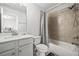 Well-lit bathroom features a shower-tub combination with tiled wall and a sleek white vanity at 4565 Grenadine Cir, Acworth, GA 30101