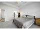 Well-lit bedroom featuring a plush bed, carpeted floors, and a view to an attached Primary closet at 4565 Grenadine Cir, Acworth, GA 30101