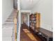Welcoming entryway showcasing hardwood floors, staircase, and built-in shelving for storage and decor at 4565 Grenadine Cir, Acworth, GA 30101