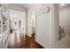 Hallway with white trim, hardwood floors, and built-in cabinets providing ample storage at 4565 Grenadine Cir, Acworth, GA 30101