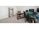 Neutral-colored home office with a desk, shelves, and lots of room for working or studying at 4565 Grenadine Cir, Acworth, GA 30101