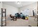 Home office with neutral carpeting, a large window, and ample desk space for working at home at 4565 Grenadine Cir, Acworth, GA 30101