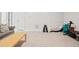 Large open living room with neutral carpet, a couch, and workout equipment at 4565 Grenadine Cir, Acworth, GA 30101