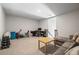 Spacious living room with carpet, a couch, a table, and workout equipment at 4565 Grenadine Cir, Acworth, GA 30101
