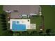 Aerial view of a backyard featuring a pool, hot tub, deck, patio, fire pit, and playground at 4976 Concert Ln, Marietta, GA 30066