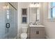 Modern bathroom features a frameless glass shower with hexagon tiles, and a neutral vanity with a white countertop at 4976 Concert Ln, Marietta, GA 30066