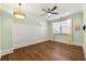 Bright bedroom with hardwood flooring, detailed trim, and ample natural light from the large window at 4976 Concert Ln, Marietta, GA 30066