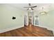 Bright bedroom with hardwood flooring, ample natural light, and ensuite bathroom access at 4976 Concert Ln, Marietta, GA 30066