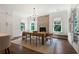 Elegant dining room with natural light and a wooden dining table at 4976 Concert Ln, Marietta, GA 30066