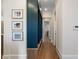 Hallway with blue lockers and stylish picture frames adding charm to the decor at 4976 Concert Ln, Marietta, GA 30066
