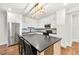 Stylish kitchen featuring a black island, stainless steel appliances, and modern cabinetry at 4976 Concert Ln, Marietta, GA 30066