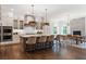 Spacious kitchen with white cabinets, stainless steel appliances, and an island with seating at 4976 Concert Ln, Marietta, GA 30066