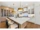 Bright kitchen with a marble island, stylish light fixtures, and stainless steel appliances at 4976 Concert Ln, Marietta, GA 30066