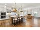Spacious kitchen with a large marble island, modern appliances, and an adjacent dining area at 4976 Concert Ln, Marietta, GA 30066